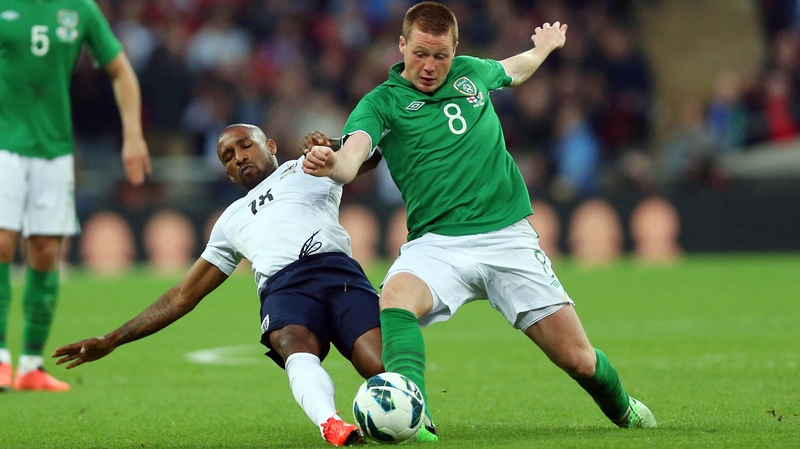 James McCarthy is tackled by Jermain Defoe in 2013