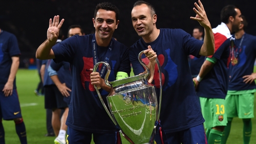 Xavi (left) and Andres Iniesta (right) celebrate Barcelona's fifth European crown