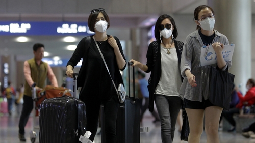 Tourists in South Korea wear masks as a precaution against the MERS virus