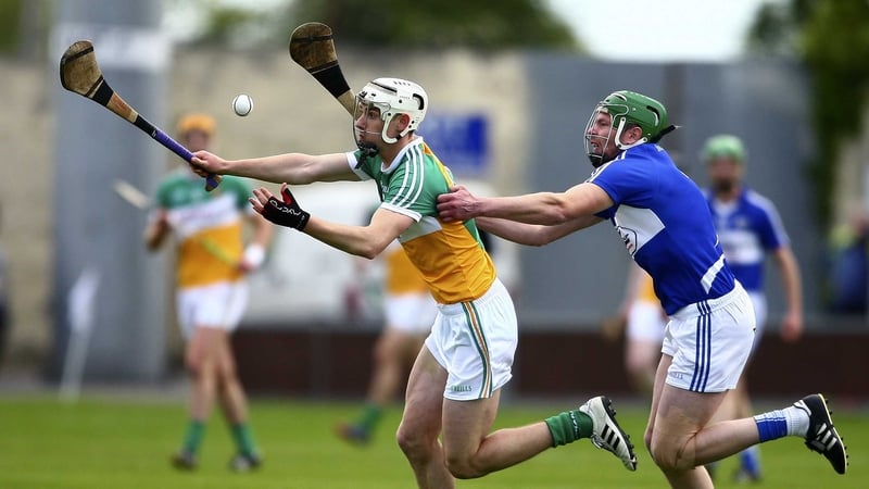 Offaly's Emmet Nolan with Zane Keenan of Laois