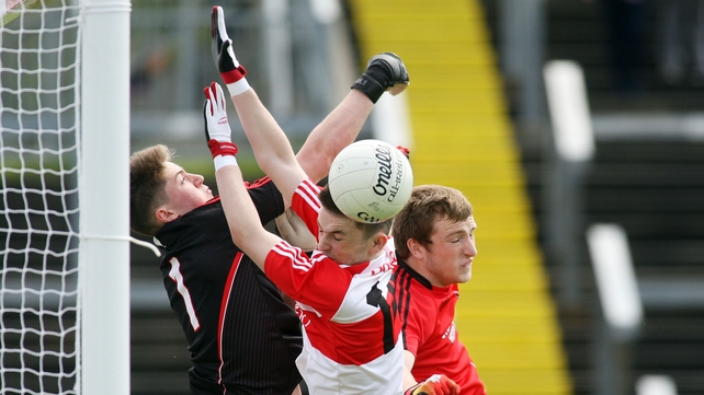 Derry's Francis Kearney with Down's Jack Heaney and Patrick Murdock during the Ulster MFC quarter-final