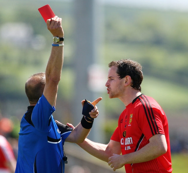 Referee Eddie Kinsella not for listening to any appeal as he sends off Down's Conaill McGovern