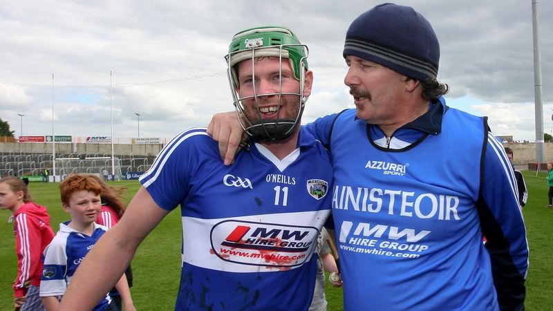 Séamus ‘Cheddar’ Plunkett with a bloodied Zane Keenan, Laois' top scorer, after the game