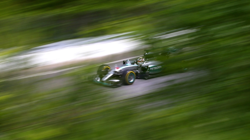 Lewis Hamilton's Mercedes seen through the foliage at the Circuit Gilles Villeneuve