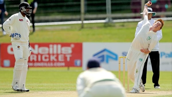 Craig Young right) bowls against the UAE