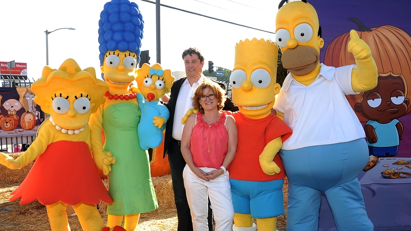 Al Jean, Nancy Cartwright (the voice of Bart Simpson) and the Simpson family