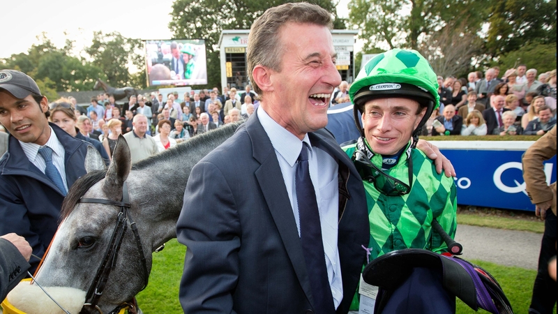Kevin Ryan celebrates with Ryan Moore after winning the QIPCO Irish Champion Stakes with The Grey Gatsby
