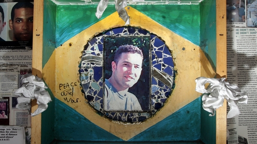 A memorial made up of press cuttings and photographs for Jean Charles de Menezes