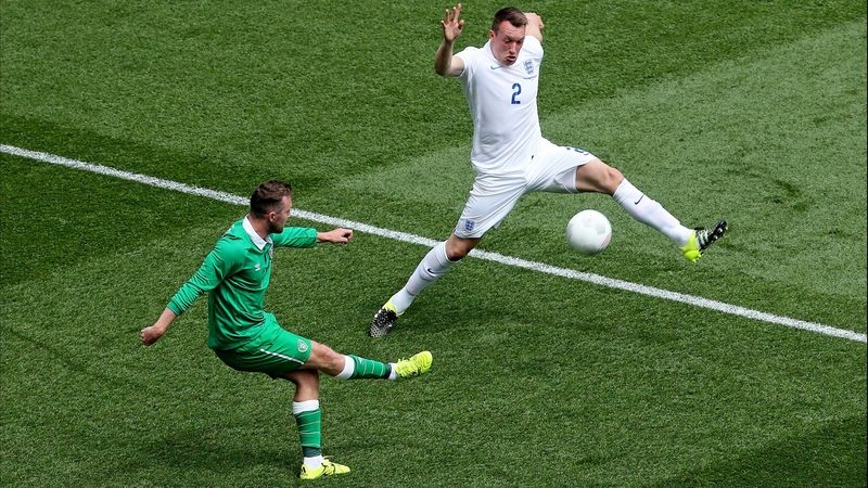 Ireland's Aiden McGeady attempts to cross a ball past England's Phil Jones