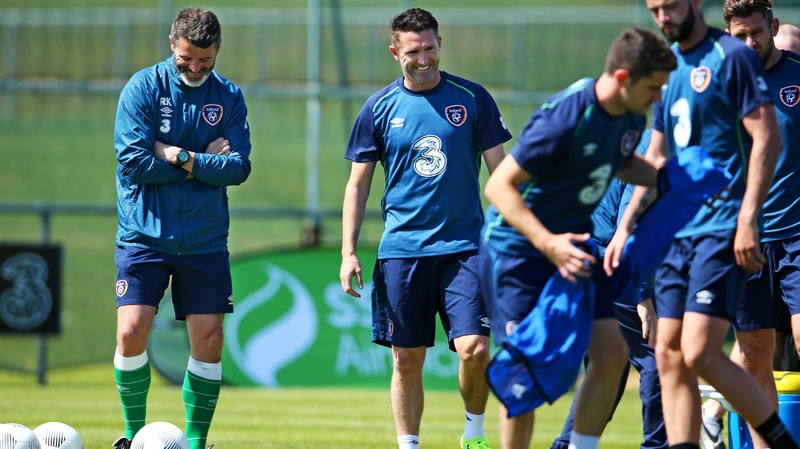 Roy Keane and Robbie Keane share a joke at training this morning