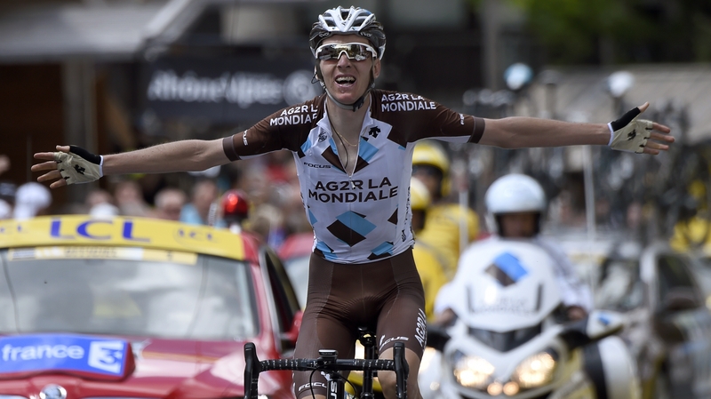 Romain Bardet celebrates as he crosses the finish line
