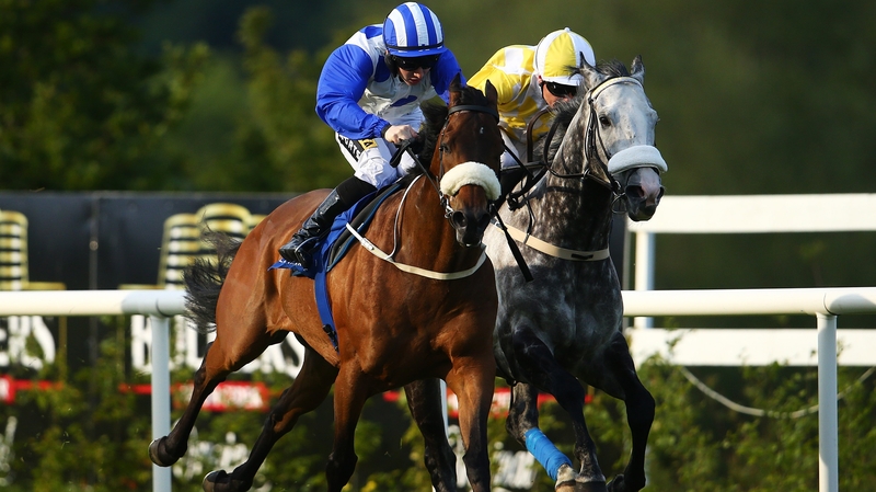 Jockey Colin Keane onboard Tennessee Wildcat goes past jockey Pat Smullen onboard Captain Joy