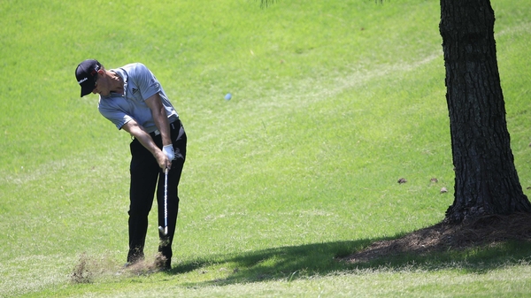 Greg Owen hits an approach shot on the sixth