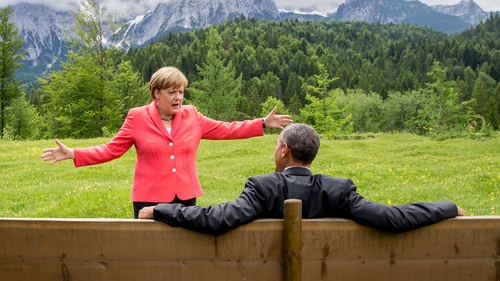 German Chancellor Angela Merkel in conversation with US President Barack Obama at the G7 conference