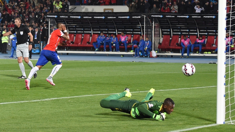 Chile's midfielder Arturo Vidal (c) runs to celebrate after scoring a penalty