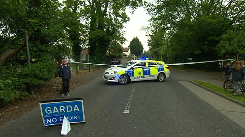 Local people say a gunman disguised as a woman fired shots at members of a pigeon club in a yard