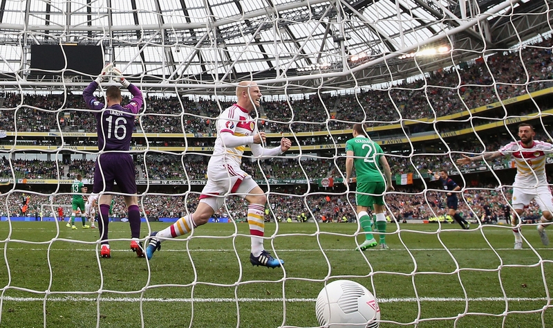 Steven Naismith wheels away in celebration after John O'Shea's own goal