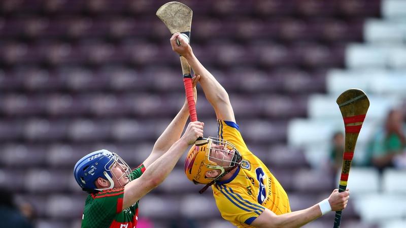 Mayo's Eoghan Collins and Cillian Egan of Roscommon contest the sliotar during their Christy Ring play-off game