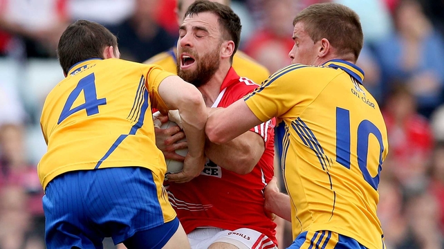No way past - Clare's Martin McMahon and Seán Collins stop Colm O’Driscoll of Cork