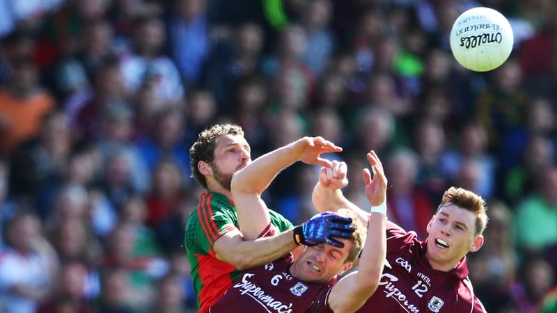 Galway's Gary O’Donnell and Tomas Flynn battle with Tom Parsons
