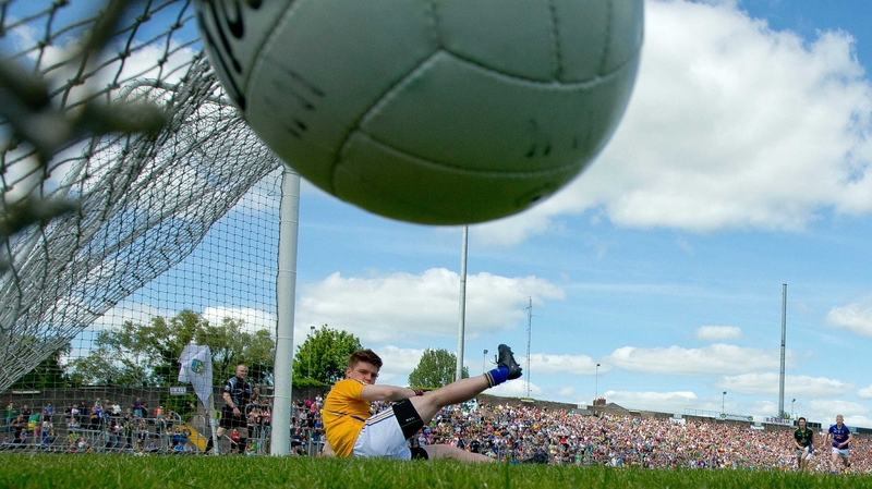 Wicklow goalkeeper Robert Lambert is beaten from the penalty spot by Meath's Andrew Tormey