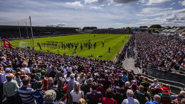 The teams parade ahead of the game