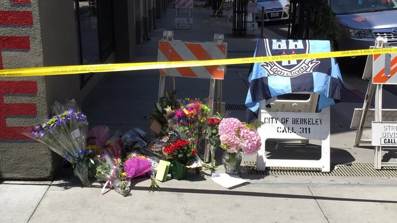 Tributes to those killed and injured have been left outside the apartment building