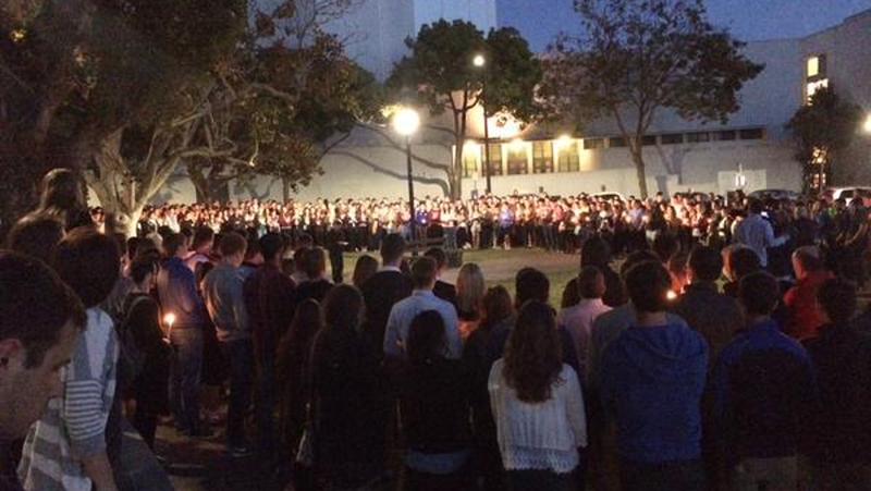 The crowd formed a large circle in the Martin Luther King Civic Center Park near the apartment complex