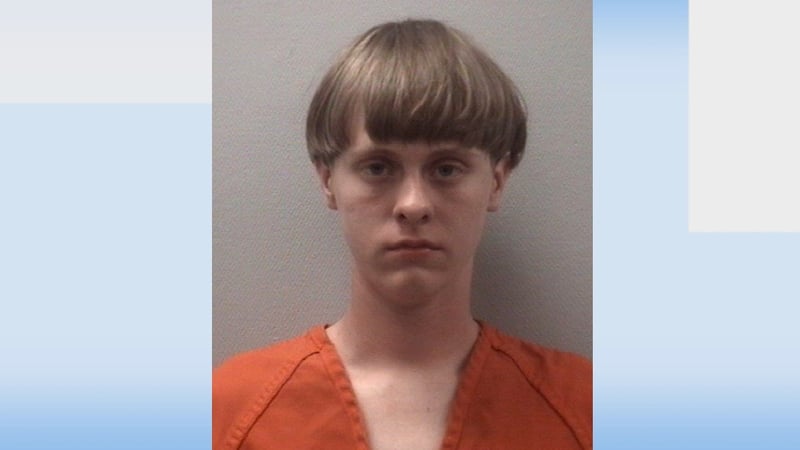 Suspect has been identified as Dylann Roof - facebook photo shows him wearing a jacket with flags of apartheid South Africa and Rhodesia
