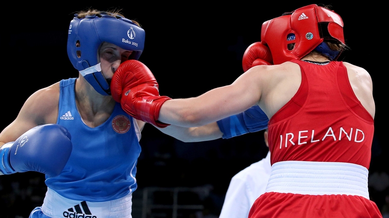 Michaela Walsh (R) lands a punch on Russia's Elena Saveleva