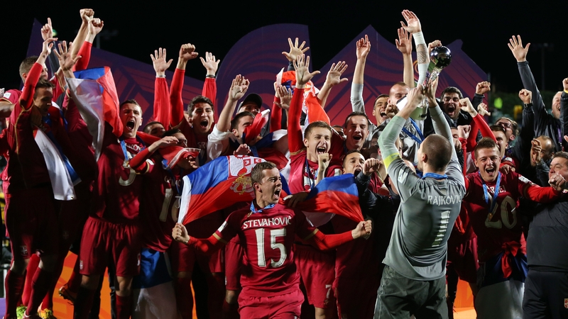 Serbia captain Predrag Rajkovic lifts the trophy after their dramatic late victory over Brazil
