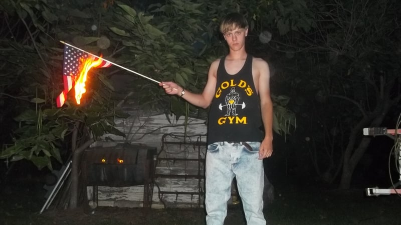 The website showed dozens of photographs of the Charleston shooter holding weapons, burning an American flag and visiting plantations