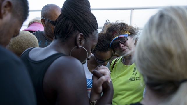 Charleston residents held hands, prayed and sang together