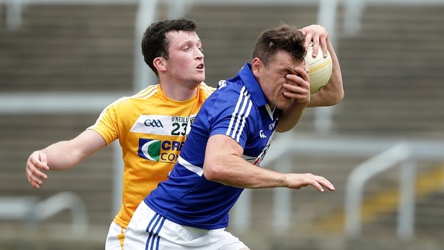 Laois' John O'Loughlin with Dermot McAleese of Antrim during the All-Ireland Football Championship qualifier on Saturday
