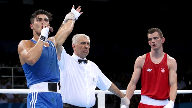 Ireland's Adam Nolan (red) looks on as Josh Kelly (blue) of Great Britain is declared the winner of their men's heavyweight bout on Tuesday at the European Games