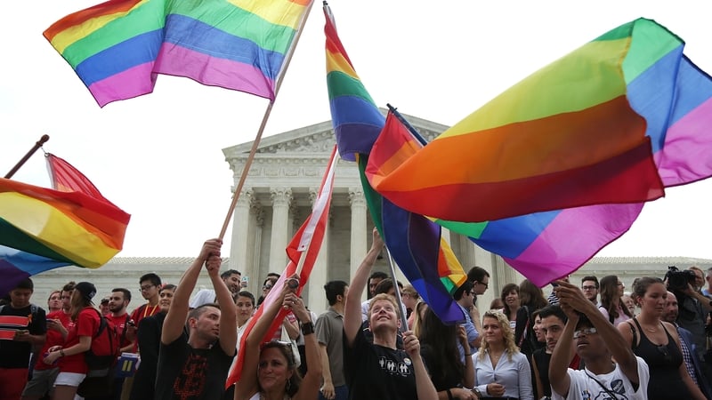 Same-sex marriage supporters celebrate outside the Supreme Court in Washington, DC