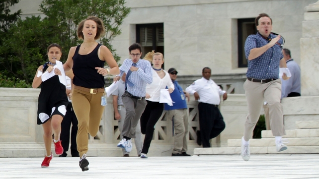 News interns run out of the Supreme Court with the verdict