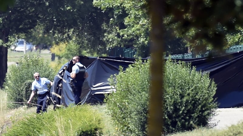 A police tent covers the decapitated remains of Herve Cornara
