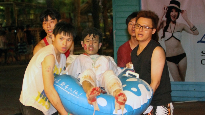 A young man is carried out of the park