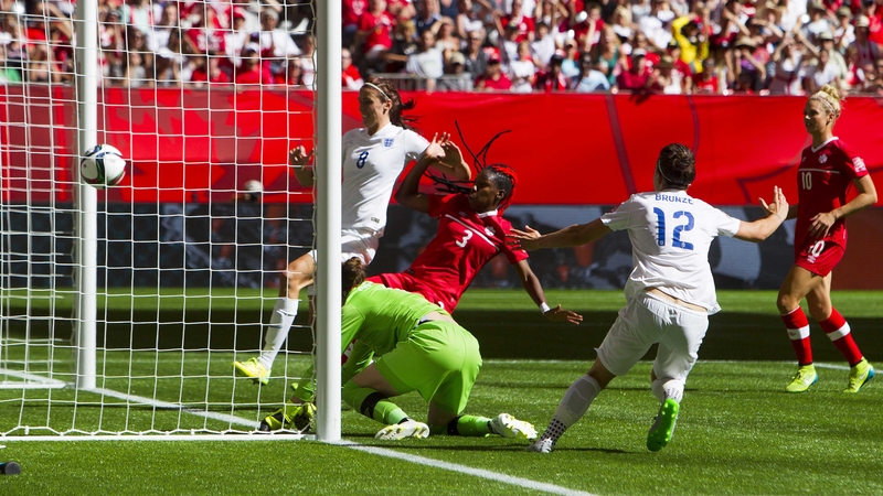 Lucie Bronze celebrates heading home England's second goal against Canada