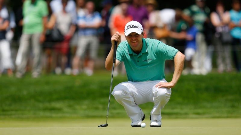 Michael Hoey of Northern Ireland lines-up a putt during the BMW International Open day four