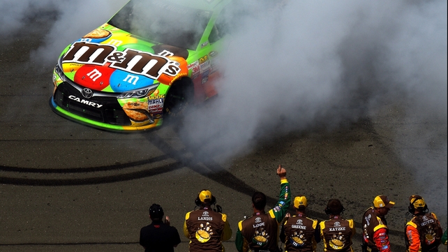 Kyle Busch celebrates with a burnout after winning the NASCAR Sprint Cup Series Toyota/Save Mart 350 at Sonoma Raceway in California
