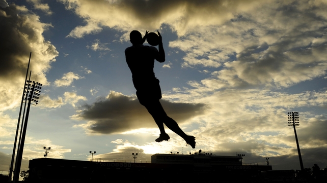 Justin O'Neill of the North Queensland Cowboys takes a high ball during the warm up of the NRL match against the Cronulla Sharks in Townsville, Australia