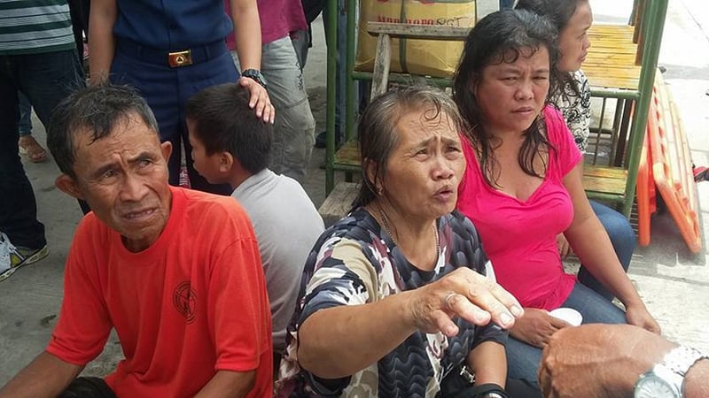 Survivors of a passenger ferry speak to local rescue officers