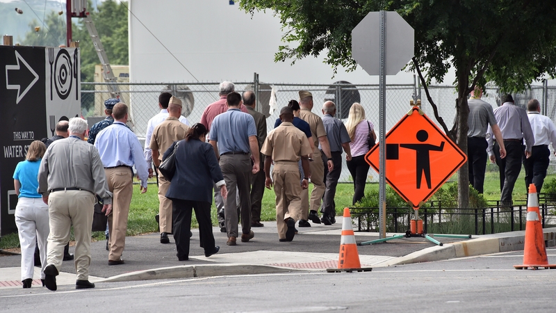 Employees of the Navy Yard returning to their offices after the lockdown