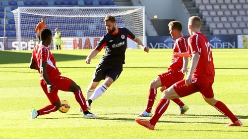 Greg Bolger is surrounded by Skonto defenders