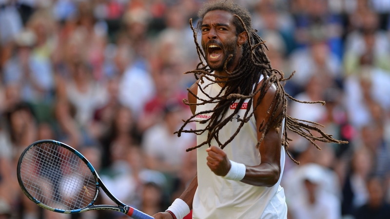 Germany's Dustin Brown celebrates the biggest win of his career