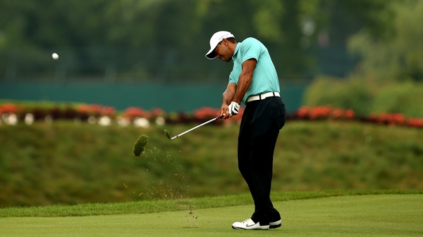 Tiger Woods takes his second shot on the 17th hole