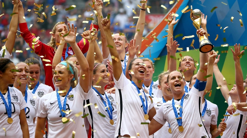 The Americans celebrate with the trophy