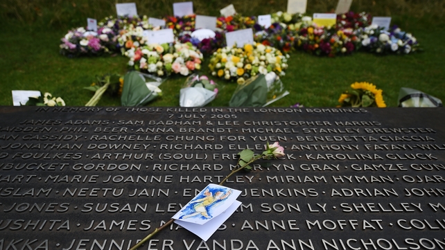 A pink rose lies on the 7/7 Memorial at Hyde Park